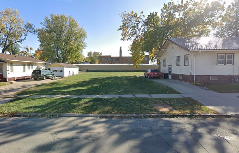 The empty lot at 411 N. Third Ave. E. has been sold to a home builder who intends to construct a single-family house on the property.