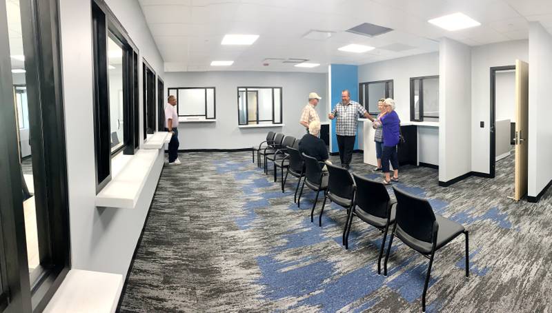 Jasper County Treasurer Doug Bishop speaks with guests during an open house on June 14 of the new administration building. Bishop says the new space will increase efficiency in the driver's license, motor vehicles and tax departments.