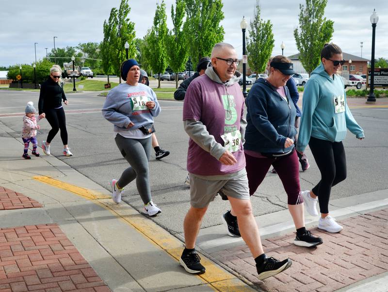 Runners participate in The Phoenix Phase Initiative's fifth annual Run For Her Life 5K and Half-Marathon on May 17 at Legacy Plaza in Newton. More than 110 people showed up for the run.