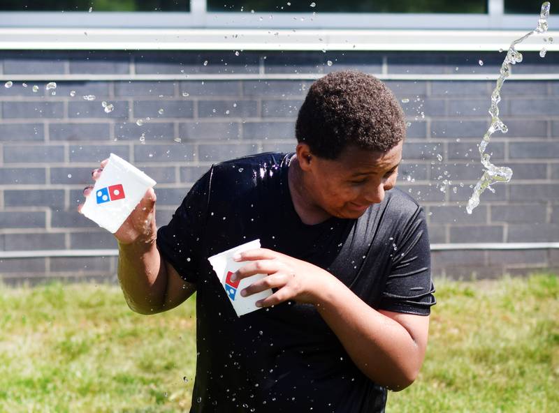 Eighth-grade students at Berg Middle School celebrate their last day as middle schoolers on May 26 by participating in carnival activities.