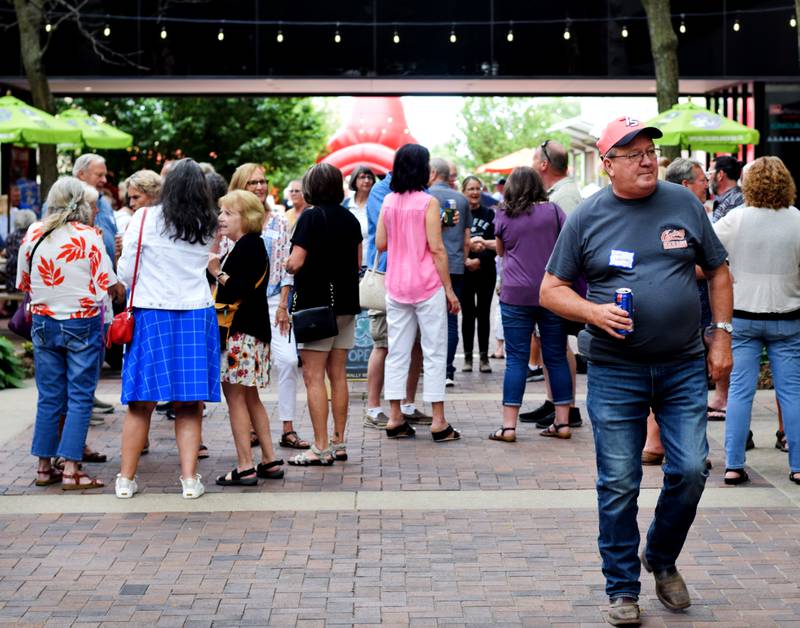 Newton High School graduates gather for drinks and camaraderie at the all-class reunion June 7 at Legacy Plaza. Newton Alumni Weekend brought back Cardinals for a weekend of partying and fellowship.