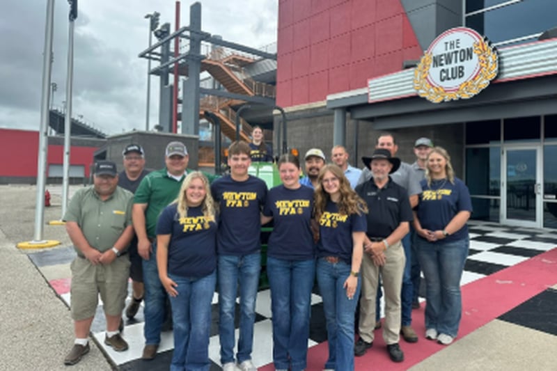 Newton FFA officers receiving the tractor Van Wall gifted the chapter.