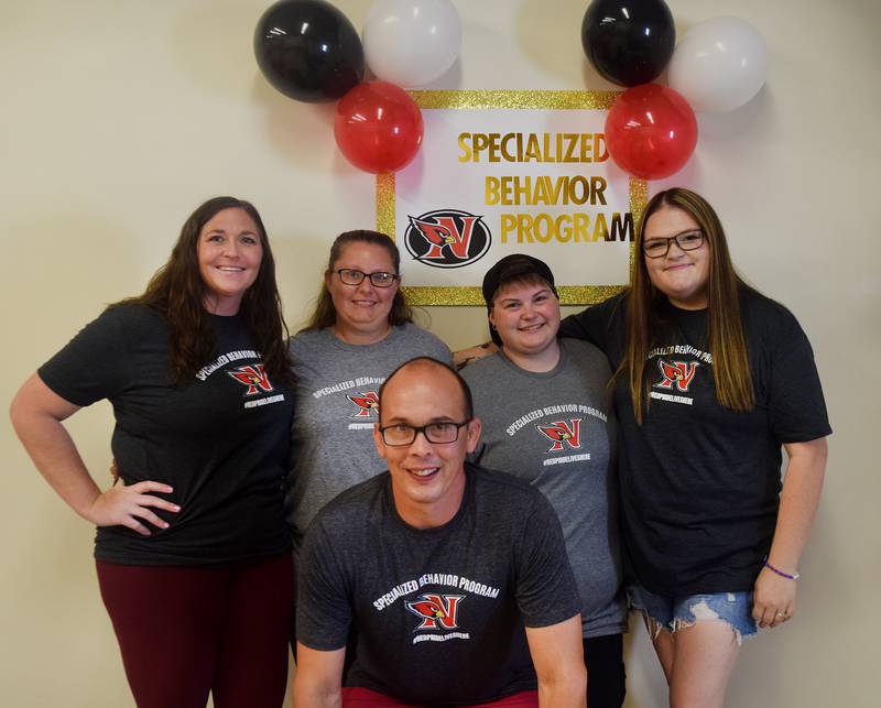 Team members of Newton Community School District's specialized behavior program pose for a picture during an open house Aug. 21 at the program's facility located at the old Progress Industries building.