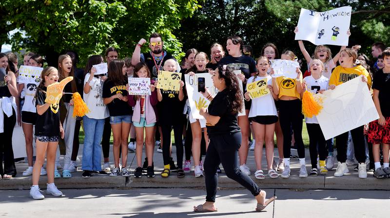 Teachers at Berg Middle School hype up students on Sept. 4 while dressed in Hawkeye and Cyclone gear in preparation for RVTV coming to town.