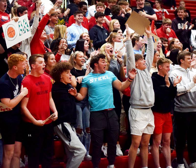 The Newton Cardinals student section cheers on their peers during The Big Game on April 19 at Newton High School.
