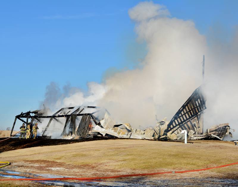 Firefighters from several Jasper County agencies extinguish the flames from a structure fire the morning of Jan. 28 at Heartland Co-op in Newton.
