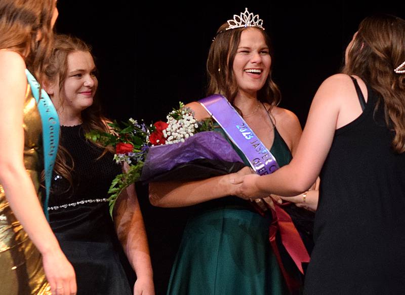 Jocelyn Harder reacts to being crowned the 2023 Jasper County Fair Queen during the fair queen contest on June 24 at the Newton Community Theatre.
