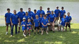 Young anglers and their police partners hook big fish at Cops and Bobbers