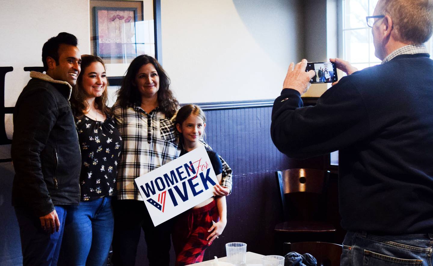 Vivek Ramaswamy, a Republican president candidate, poses for pictures with guests during a Jan. 3 commit-to-caucus event at Okoboji Grill in Newton.