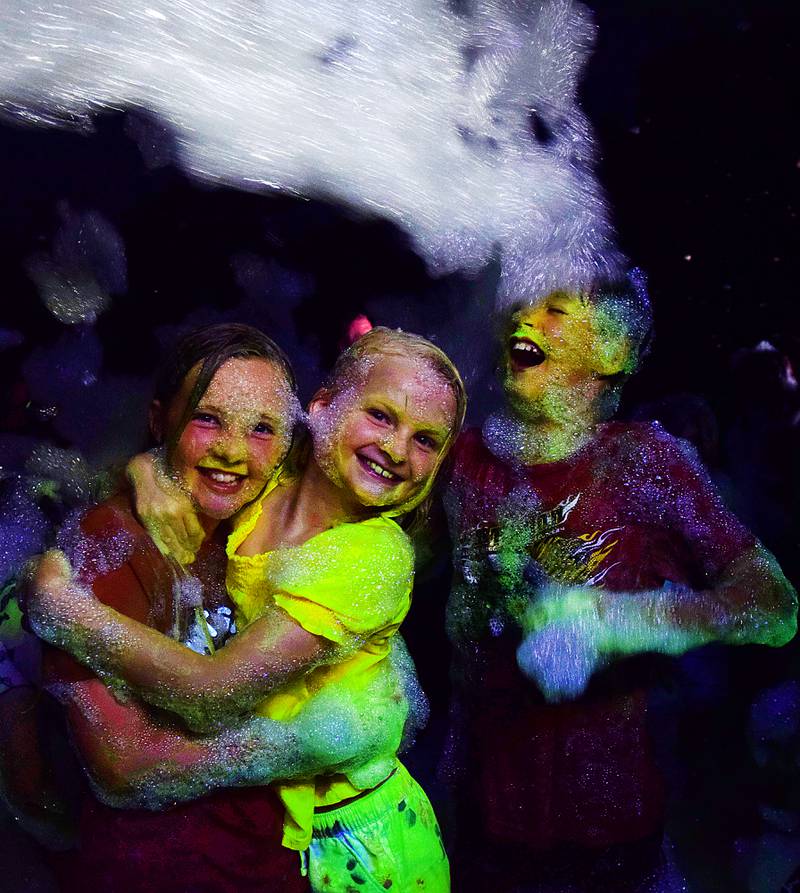 Kids enjoy the return of the Glow Foam Party – which featured two cannons this year – during Newton Fest on June 7 at Maytag Park.