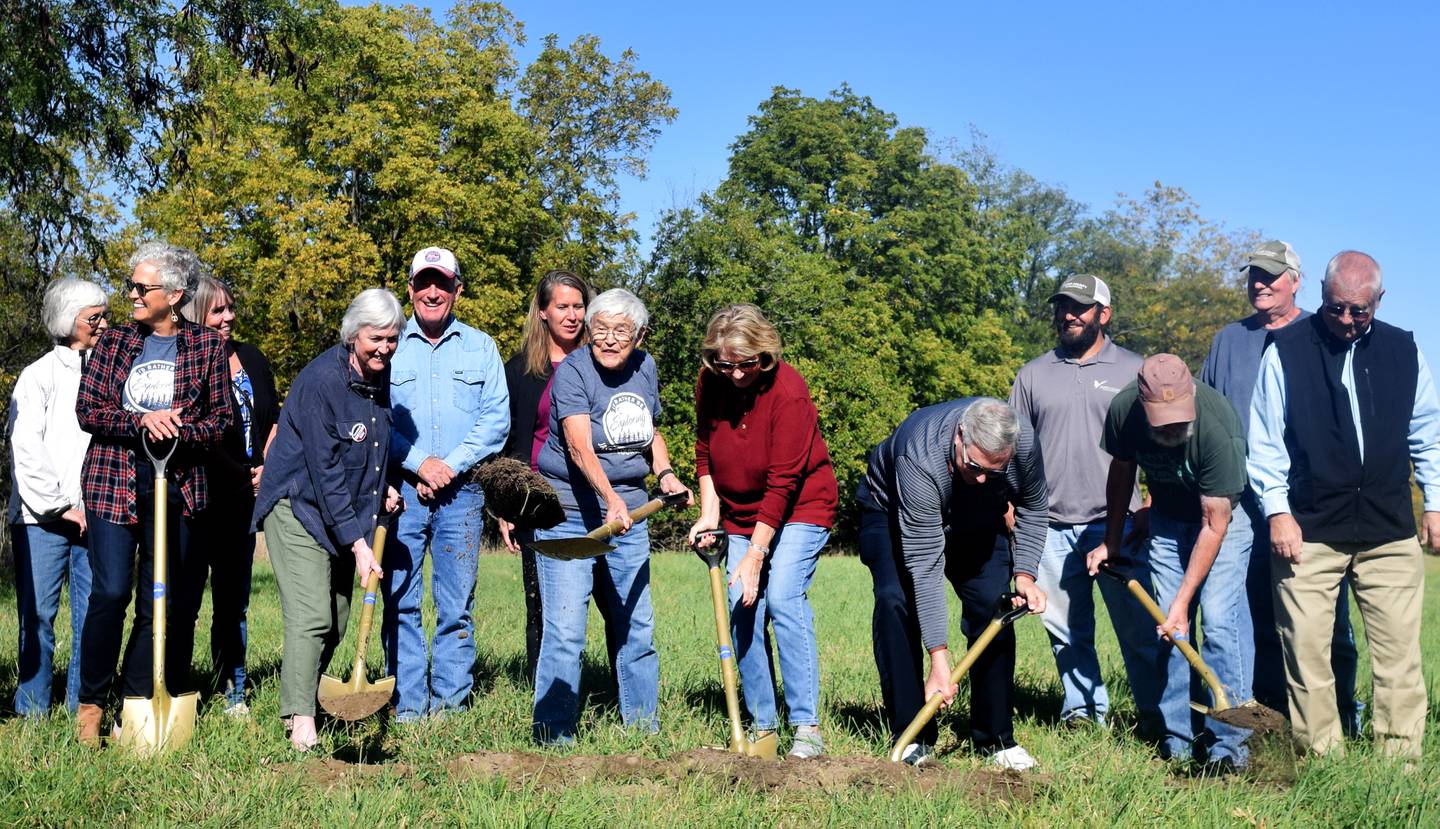 Stakeholders, staff and supporters of Jasper County Conservation gather Oct. 7 for a ceremonial groundbreaking at the site of the future environmental education center in Newton.