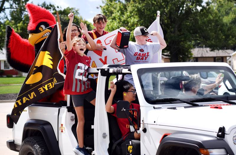 Students selected to lead the RVTV crews through a mini-parade outside Berg Middle School on Sept. 4 wave and pose to their fellow classmates.