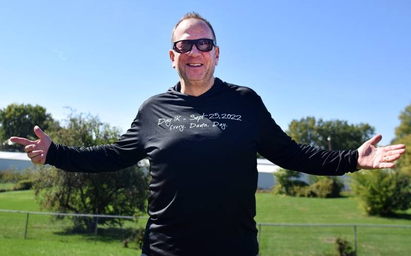 Dave McNeer, 61, of Newton shows off his shirt commemorating his 1,000 days of consecutive exercise. McNeer celebrated the big win with his family members and is determined to hit his next goal of 2,000 consecutive days.