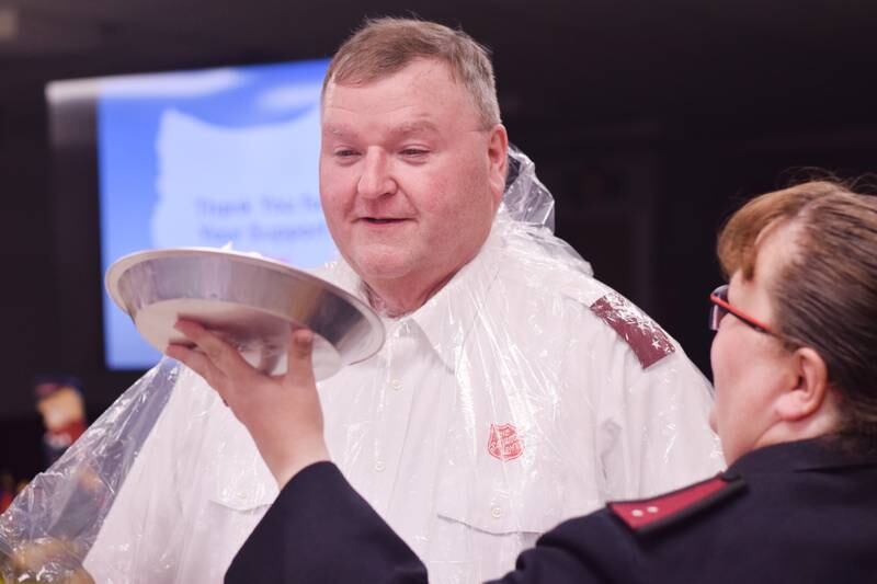 As a result of Rotary raising more funds for the Salvation Army than Kiwanis, Captain  Tim North voluntarily took a pie to the face during a volunteer recognition dinner April 19 at the organization's Newton headquarters.