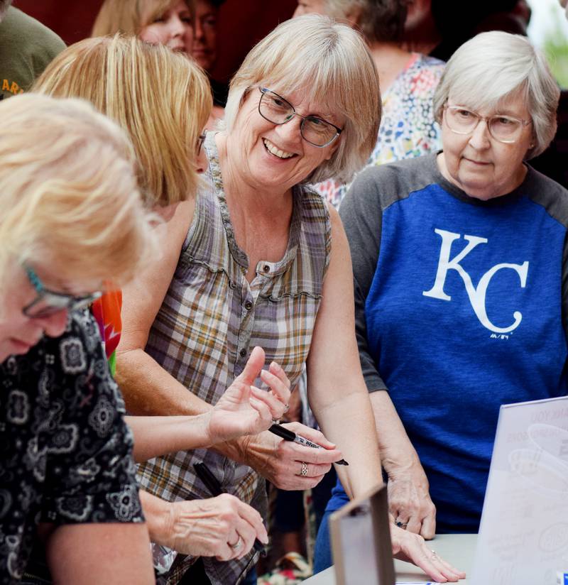 Newton High School graduates gather for drinks and camaraderie at the all-class reunion June 7 at Legacy Plaza. Newton Alumni Weekend brought back Cardinals for a weekend of partying and fellowship.