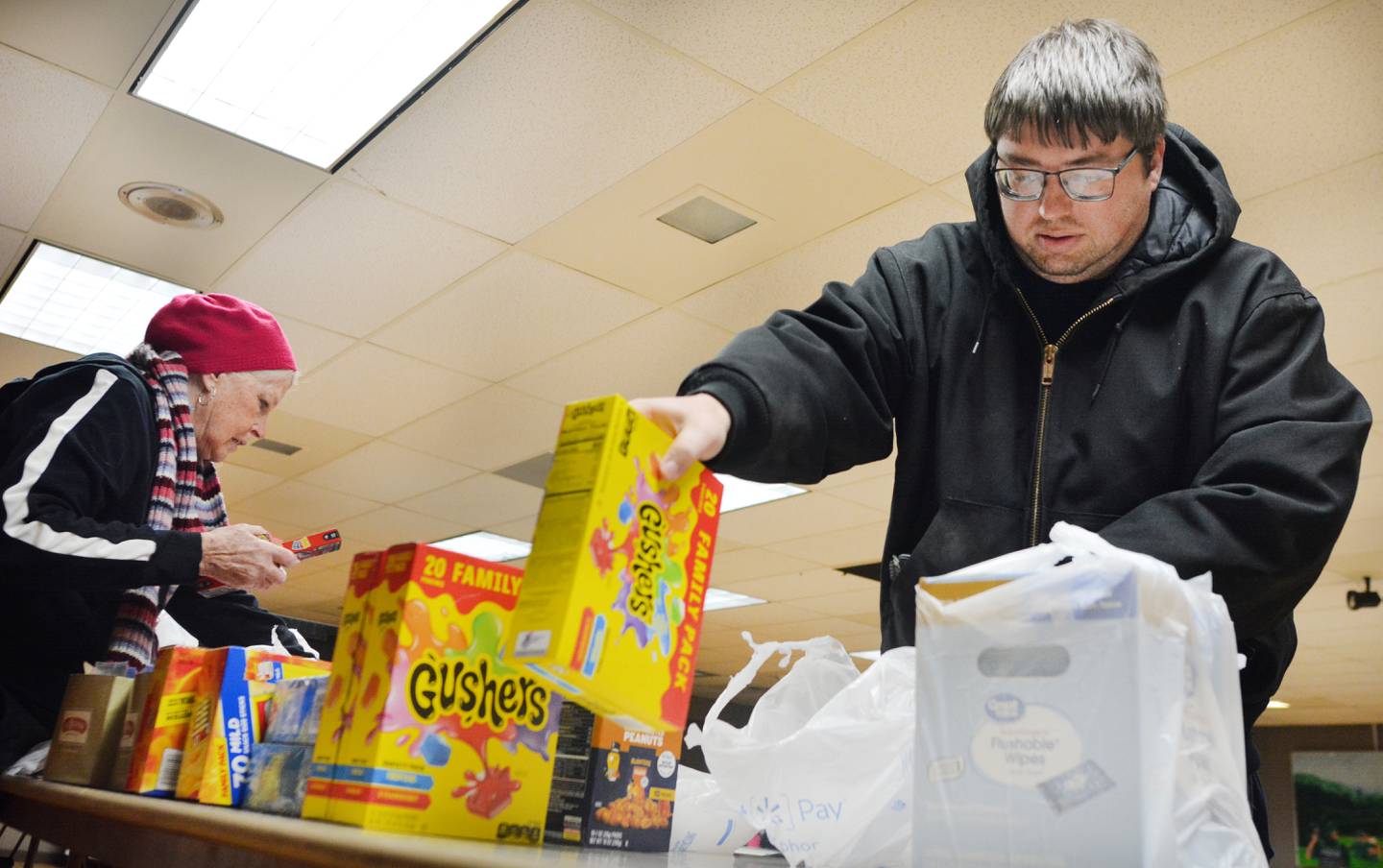 Volunteers and veterans participate in a care package event Monday, Dec. 29, 2025 at the American Legion Post 111 in Newton. The care packages will be going to the unit of the two Iowa National Guard soldiers who were killed in action in Syria.