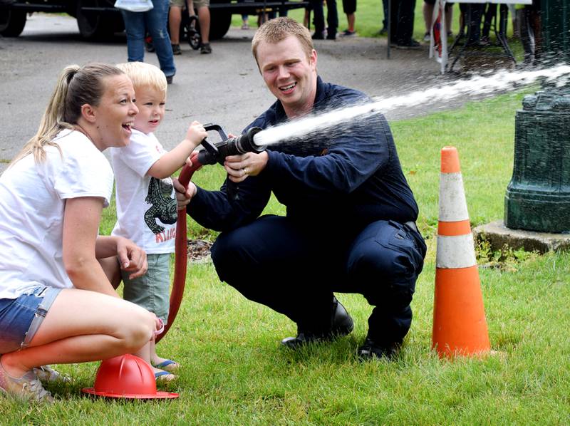 Kids and families participate in Safety Fest activities during Newton Fest on June 11, 2022, in Maytag Park.