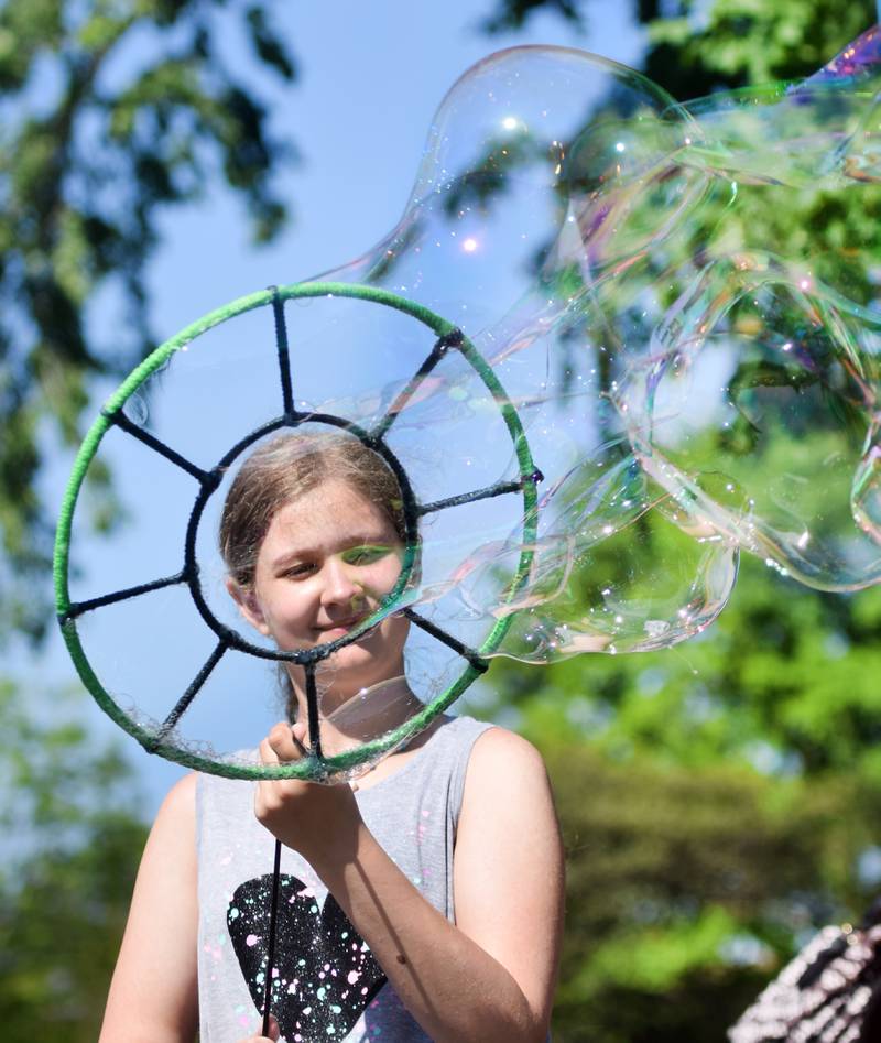 Lots of children participate in the Absolute Science Bubble Open House on June 20 at the Newton Public Library.