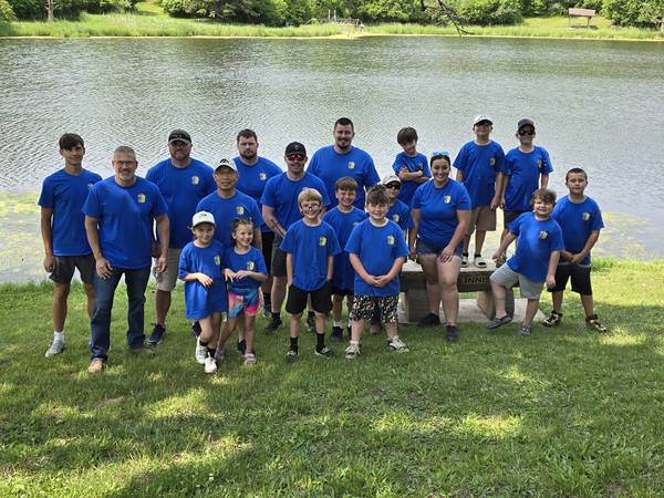 Young anglers and their police partners hook big fish at Cops and Bobbers