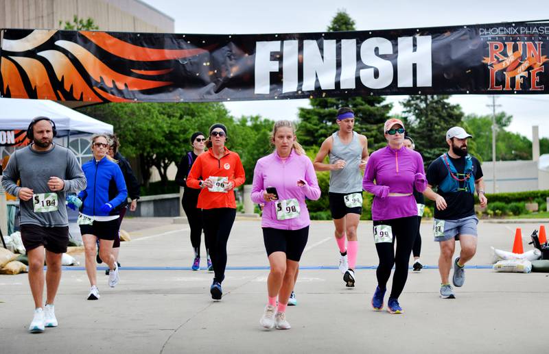 Runners participate in The Phoenix Phase Initiative's fifth annual Run For Her Life 5K and Half-Marathon on May 17 at Legacy Plaza in Newton. More than 110 people showed up for the run.