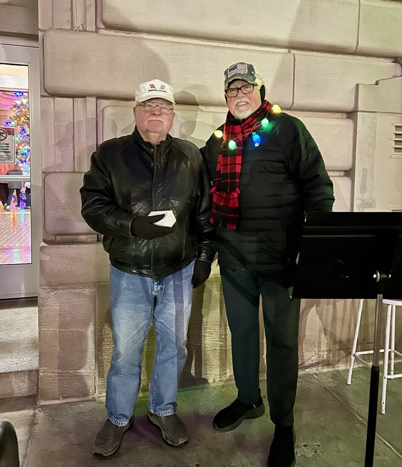 Randy Wagner, left, was the winner of the drawing to turn the courthouse Christmas lights on. Steve Knight represents the Christmas Lights Committee.