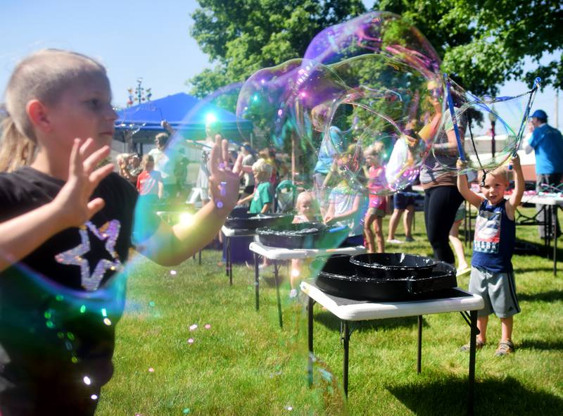 Lots of children participate in the Absolute Science Bubble Open House on June 20 at the Newton Public Library.