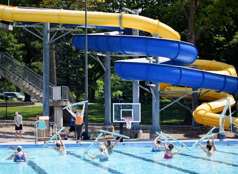 Swimmers participate in water yoga activities as part of Newton Fest on Friday, June 9 at Maytag Pool. The class was organized by the City of Newton and hosted by Red Sun Yoga.