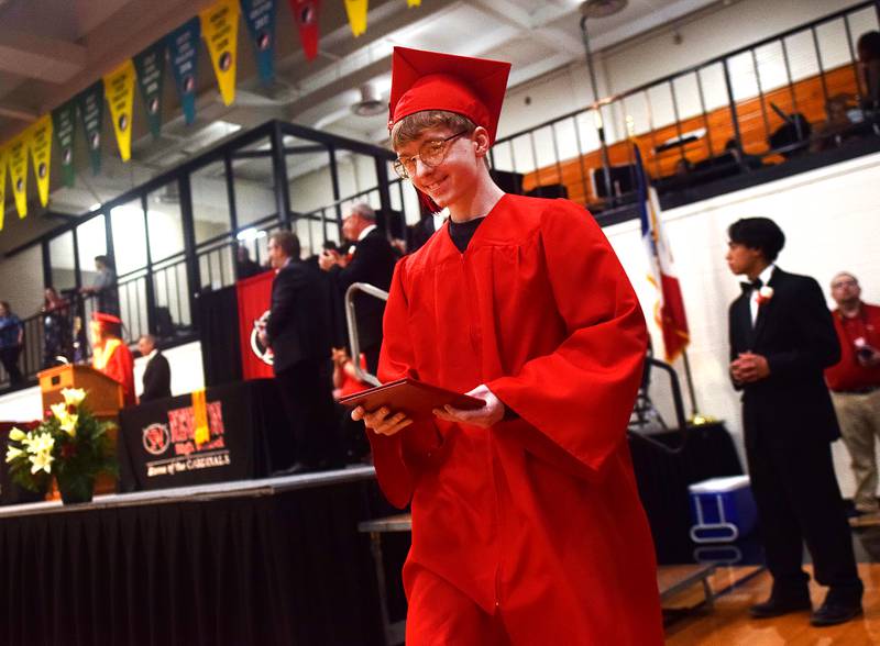 The Newton High School Class of 2024 seniors walk the stage during commencement on May 19 inside the high school gymnasium.