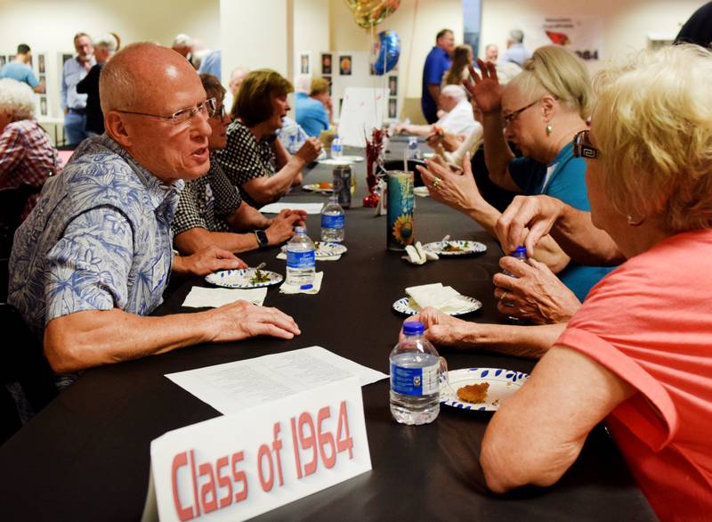 Newton High School graduates gather for drinks and camaraderie at the all-class reunion June 7 at Legacy Plaza. Newton Alumni Weekend brought back Cardinals for a weekend of partying and fellowship.