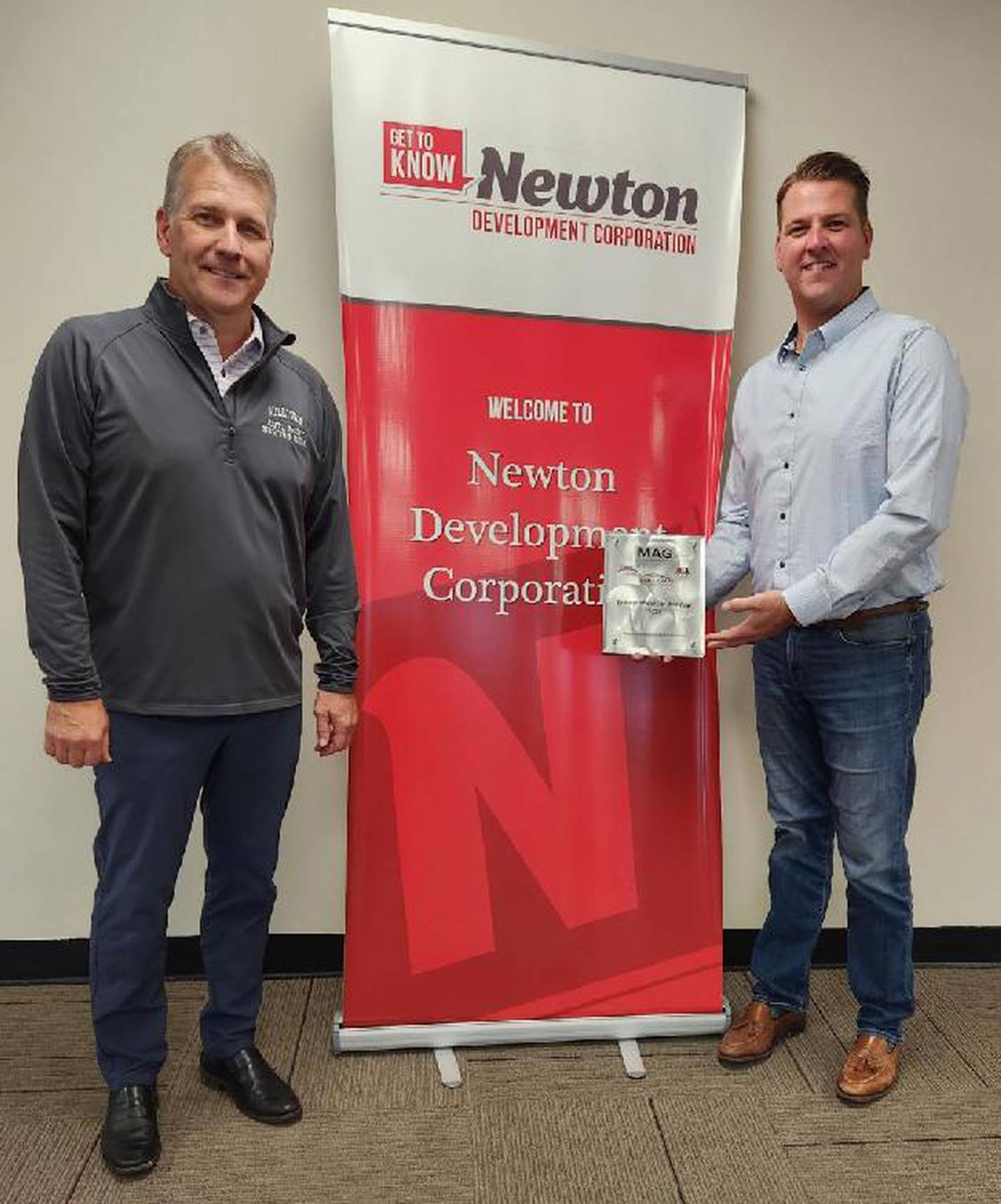 Coridan McGinley and Cameron McGinley of McGinley Auto Group pose for a picture with their award received Oct. 12 at the Newton Development Corporation's Salute to Business & Industry.