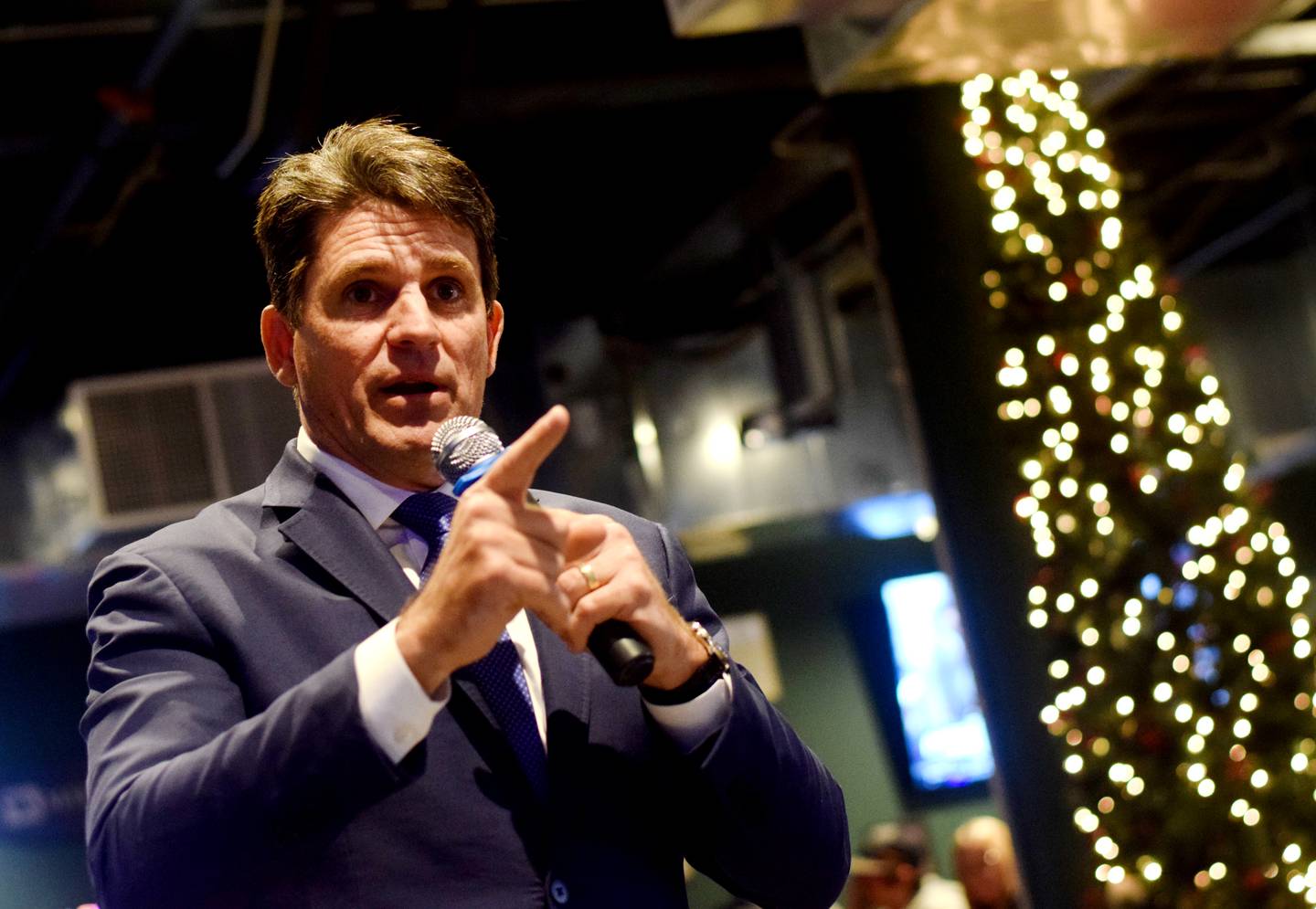 Ryan Binkley, a Republican presidential candidate, speaks to guests during a Dec. 28 campaign stop at Murph & Mary's Pub in Newton.