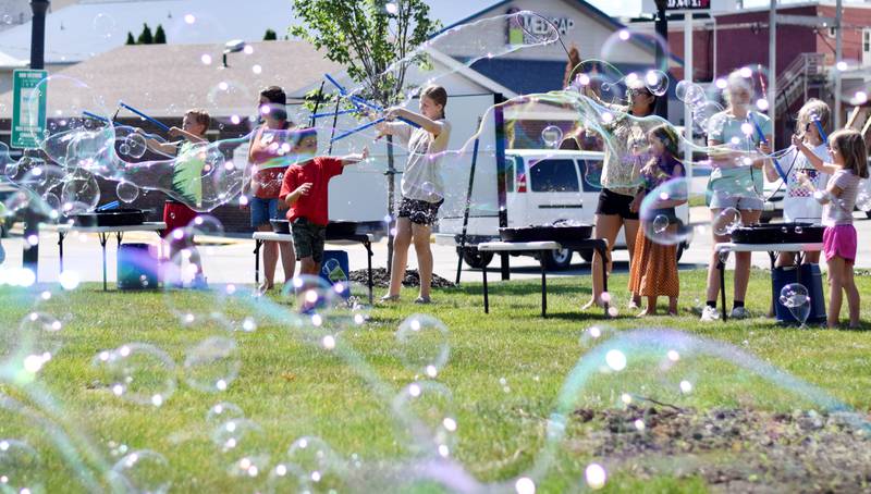 Lots of children participate in the Absolute Science Bubble Open House on June 20 at the Newton Public Library.