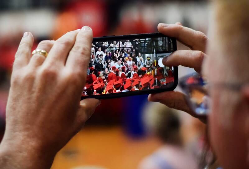 The Newton High School Class of 2024 seniors walk the stage during commencement on May 19 inside the high school gymnasium.
