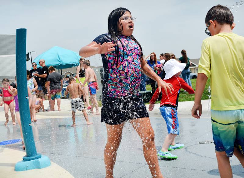 Families and children enjoy the new splash pad facilities. The Greater Newton Area Chamber of Commerce, Newton Main Street and the City of Newton held a ribbon cutting ceremony for the splash pad on June 6.