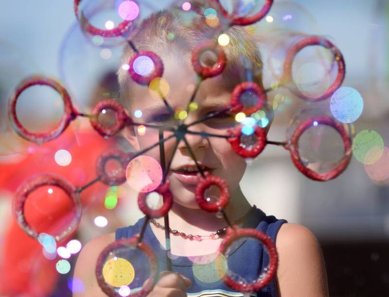 Lots of children participate in the Absolute Science Bubble Open House on June 20 at the Newton Public Library.