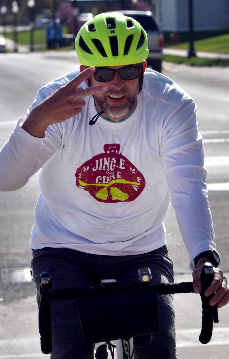 Runners, walkers and young bikers take off for the Run For Her Life 5K organized by nonprofit Phoenix Phase Initiative on April 29 at Legacy Plaza in Newton.