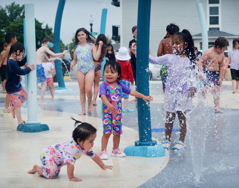 Families and children enjoy the new splash pad facilities. The Greater Newton Area Chamber of Commerce, Newton Main Street and the City of Newton held a ribbon cutting ceremony for the splash pad on June 6.
