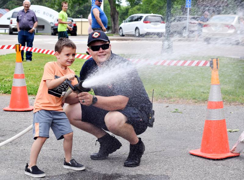 Local first responders show off emergency vehicles and have kids participate in an obstacle course as part of Safety Fest during Newton Fest on Saturday, June 10 at Maytag Park.