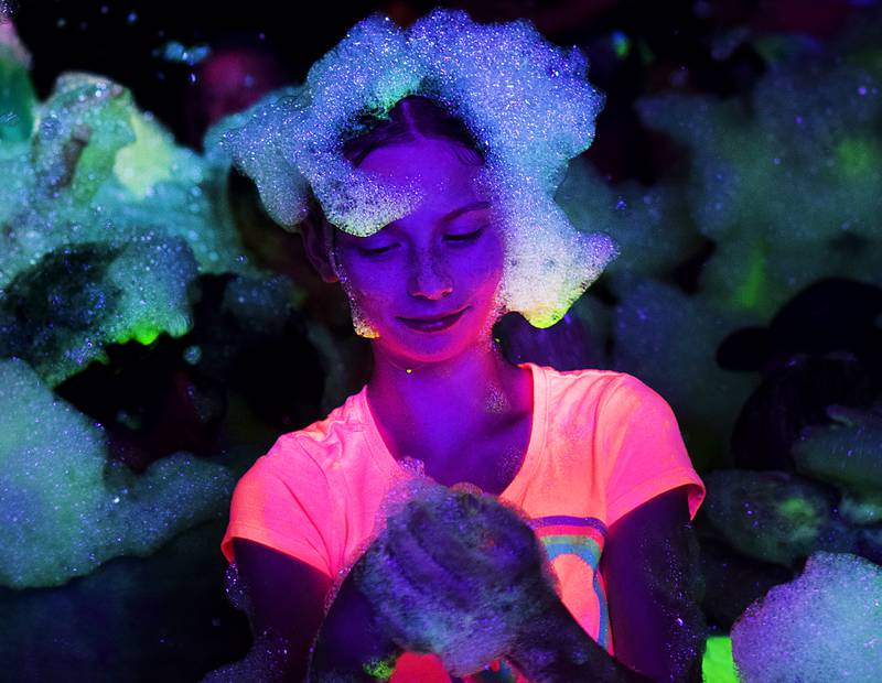 Kids enjoy the return of the Glow Foam Party – which featured two cannons this year – during Newton Fest on June 7 at Maytag Park.