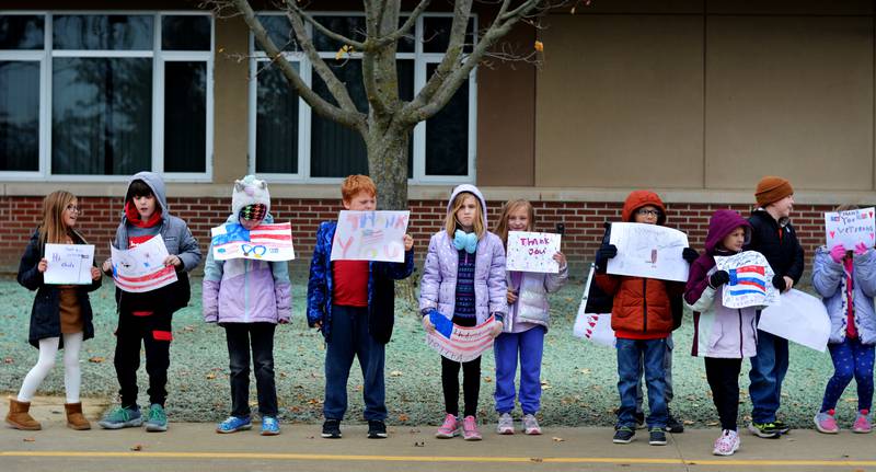 Newton Community School District students and staff participate in a Veterans Day Reverse Parade on Nov. 11, which extended to a number of school buildings in the area.